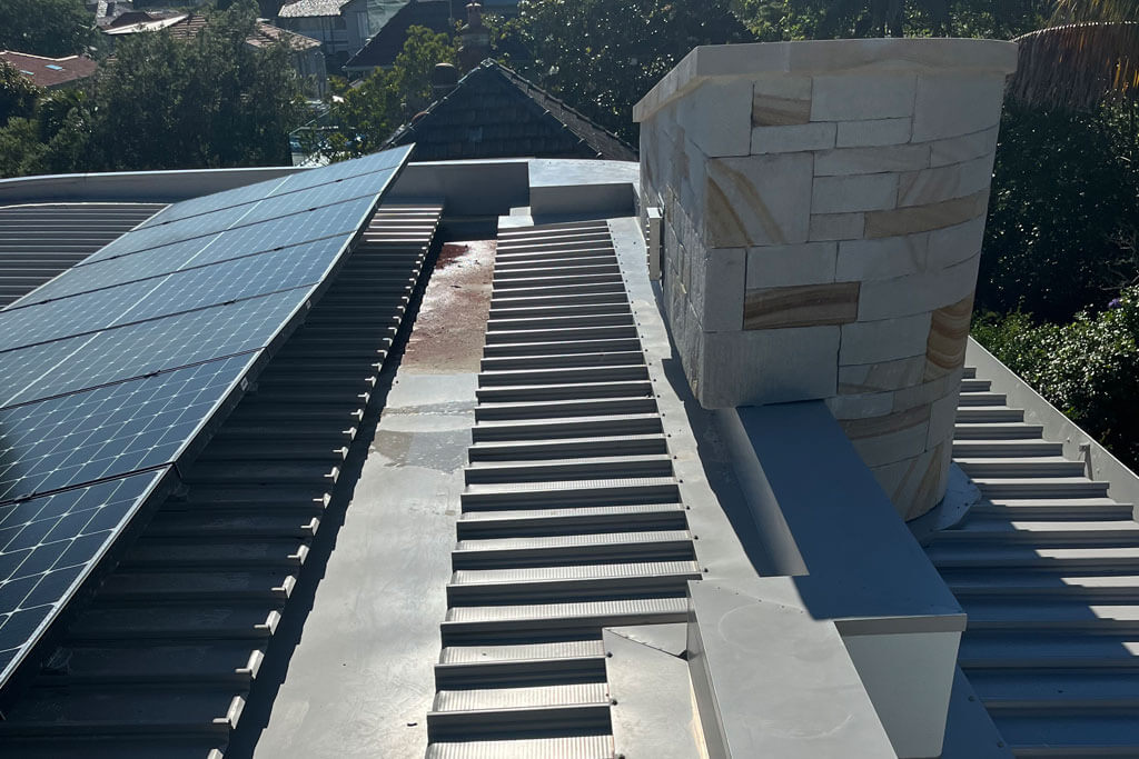 Flat roof with metal roofing and polycrystalline solar panel